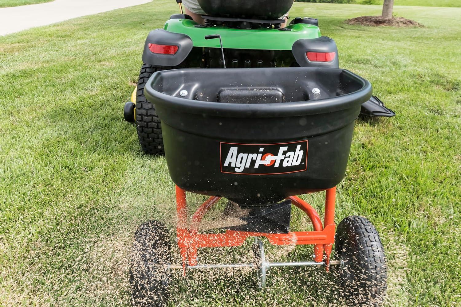 imageAgriFab 450527 110 lb Tow Behind Lawn ampamp Garden Broadcast Spreader for SeedFertilizerSaltIce Melt Easy to use Flow Control from Seat of Riding Lawn Mower110lb Capacity