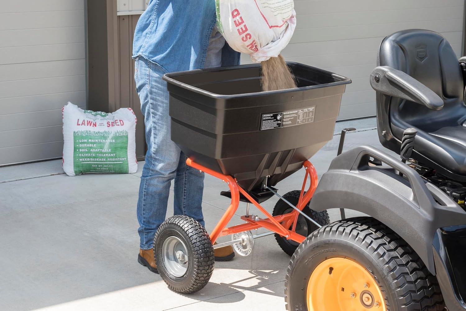 imageAgriFab 450547 185 lb TowBehind Lawn ampamp Garden Broadcast Spreader for SeedFertilizerSaltIce Melt Easy to use Flow Control from Seat of Riding Lawn Mower
